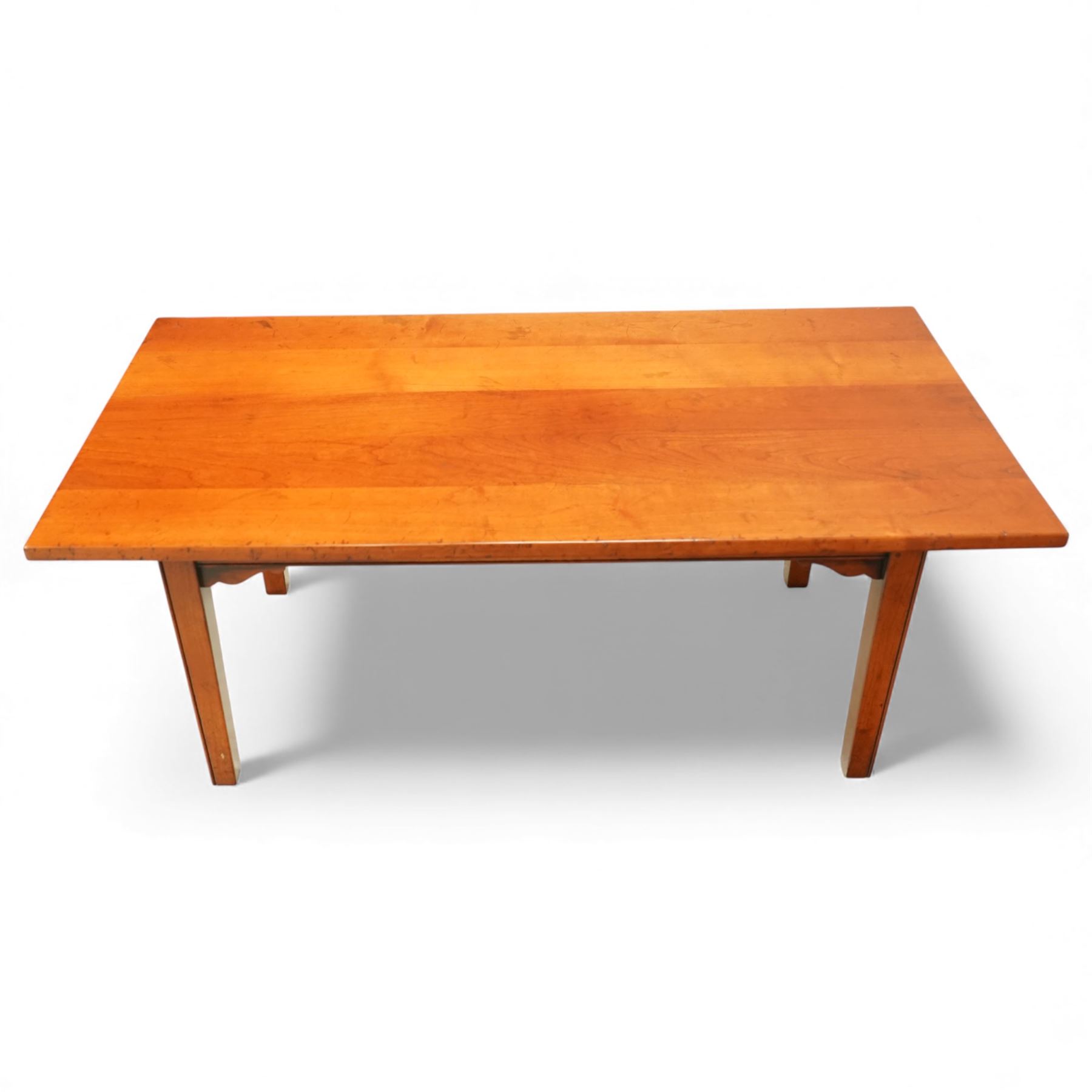 Mid 20th century french hardwood coffee table, rectangular top with gently chamfered edge, raised on square tapering supports united by simple corner brackets