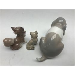 Lladro figures of animals, comprising Mini Lion no 5436, Beautiful Burro no 5683, Hawk Owl no 5422, Beagle Puppy Sitting no 1071, Duck Flying no 1264, Miniature Cat no 5308 and Small Papillon Dog no 4749, four with original boxes, largest example H14cm