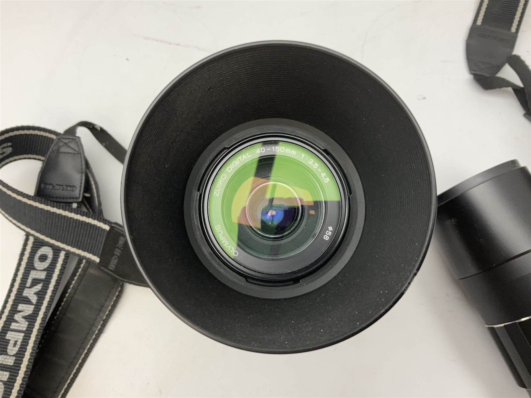 Three Olympus Camera bodies, comprising of OM-D E-M5, E-400 and E-450,   together with 'Samyang Mirror Lens 800mm 1:8.0DX', Olympus 'Zuiko Digital 40-150mm 1;3.5-4.5mm' lens, three other lenses and Velbon CX444 tripod 