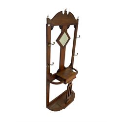 Early 20th century oak hall stand, central lozenge shaped bevelled mirror, flanked by four coat hooks, small compartment with hinged lid flanked by two umbrella stands