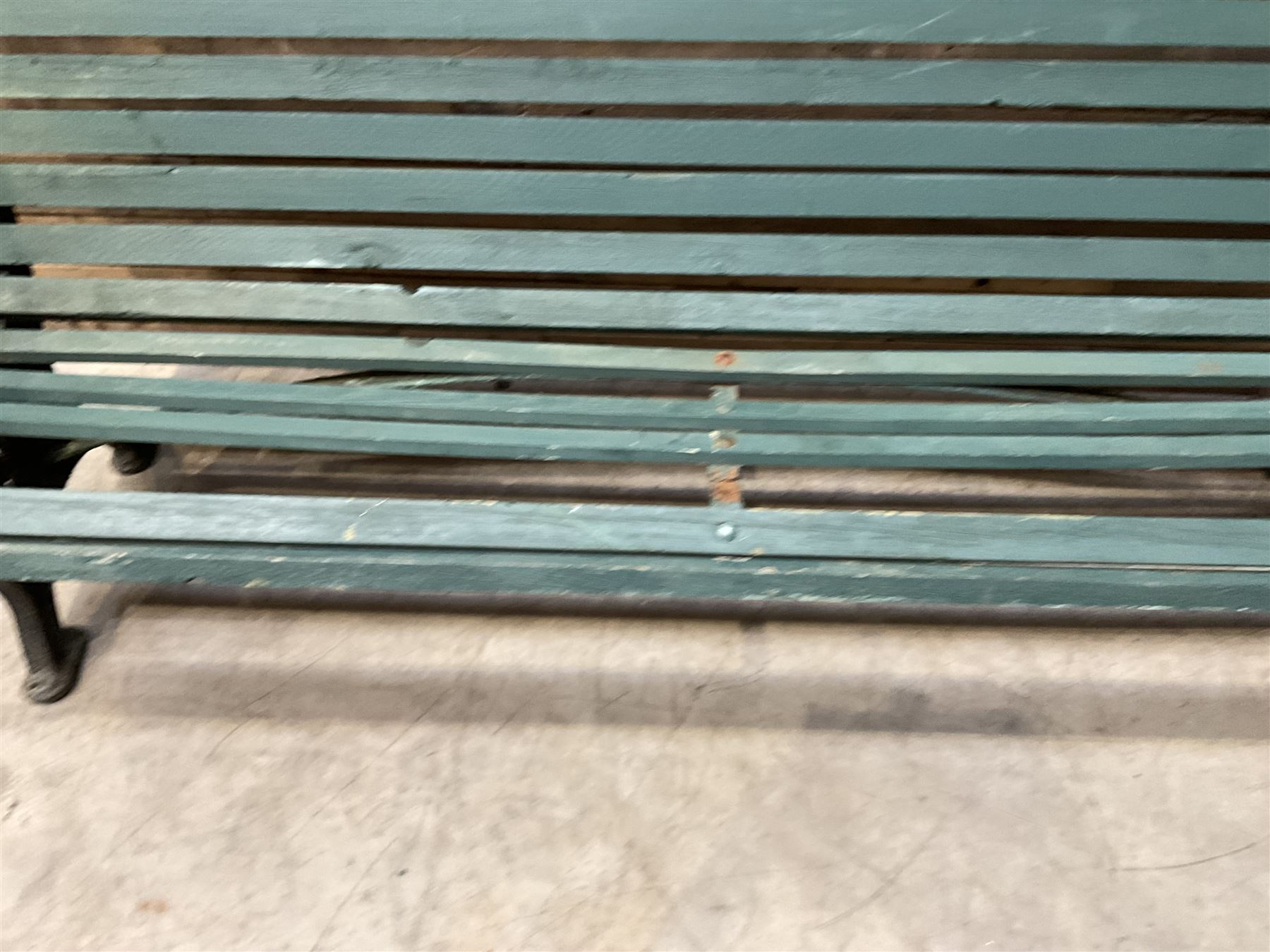 Early 20th century slatted garden bench with scrolling cast iron bench ends