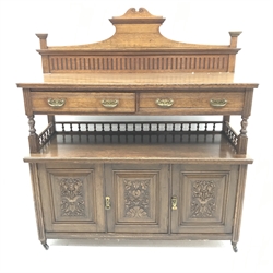 Edwardian oak sideboard, raised shaped back, two drawers above galleried shelf, three carved cupboard doors, W138cm, H155cm, D51cm