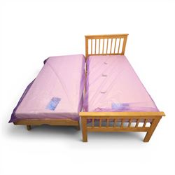 Contemporary light oak trundle bed, slatted headboard and footboard,  incorporating pull-out trundle bed on castors, complete with two memory foam mattresses