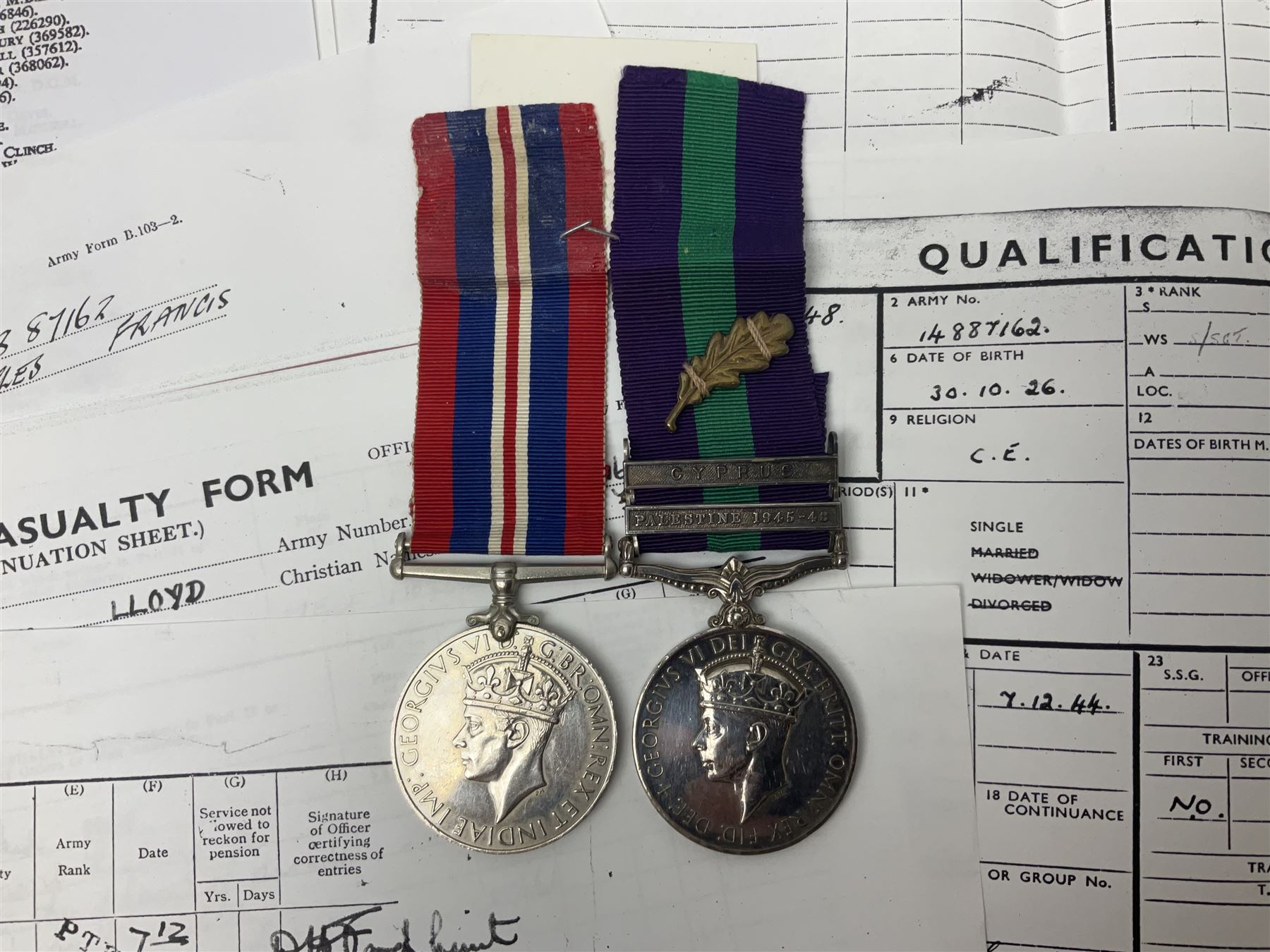 George VI General Service Medal with two clasps for Palestine 1945-48 and Cyprus and MID oak leaf awarded to 14887162 Sjt. C.F.A. Lloyd R.A.M.C. together with WW2 War Medal 1939-1945; both with ribbons; and quantity of photocopied research material including Army Records and London Gazette