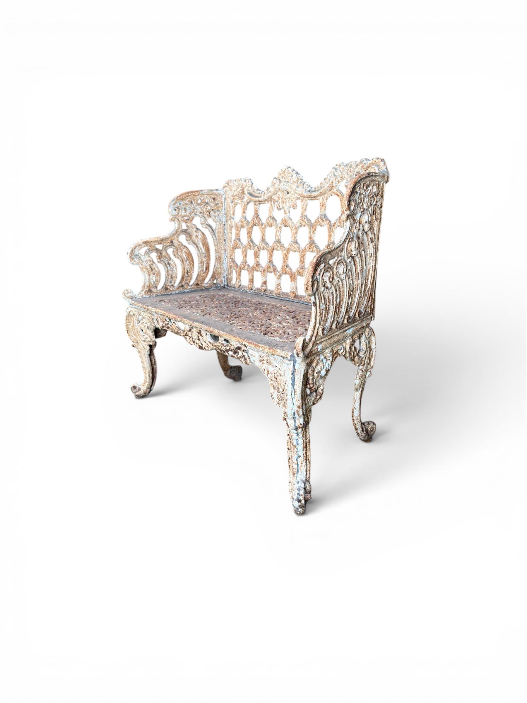 Victorian revival Carron Foundry design heavy cast iron two seat garden bench, scrolled arms with pierced lattice seat, finished in antique white paint