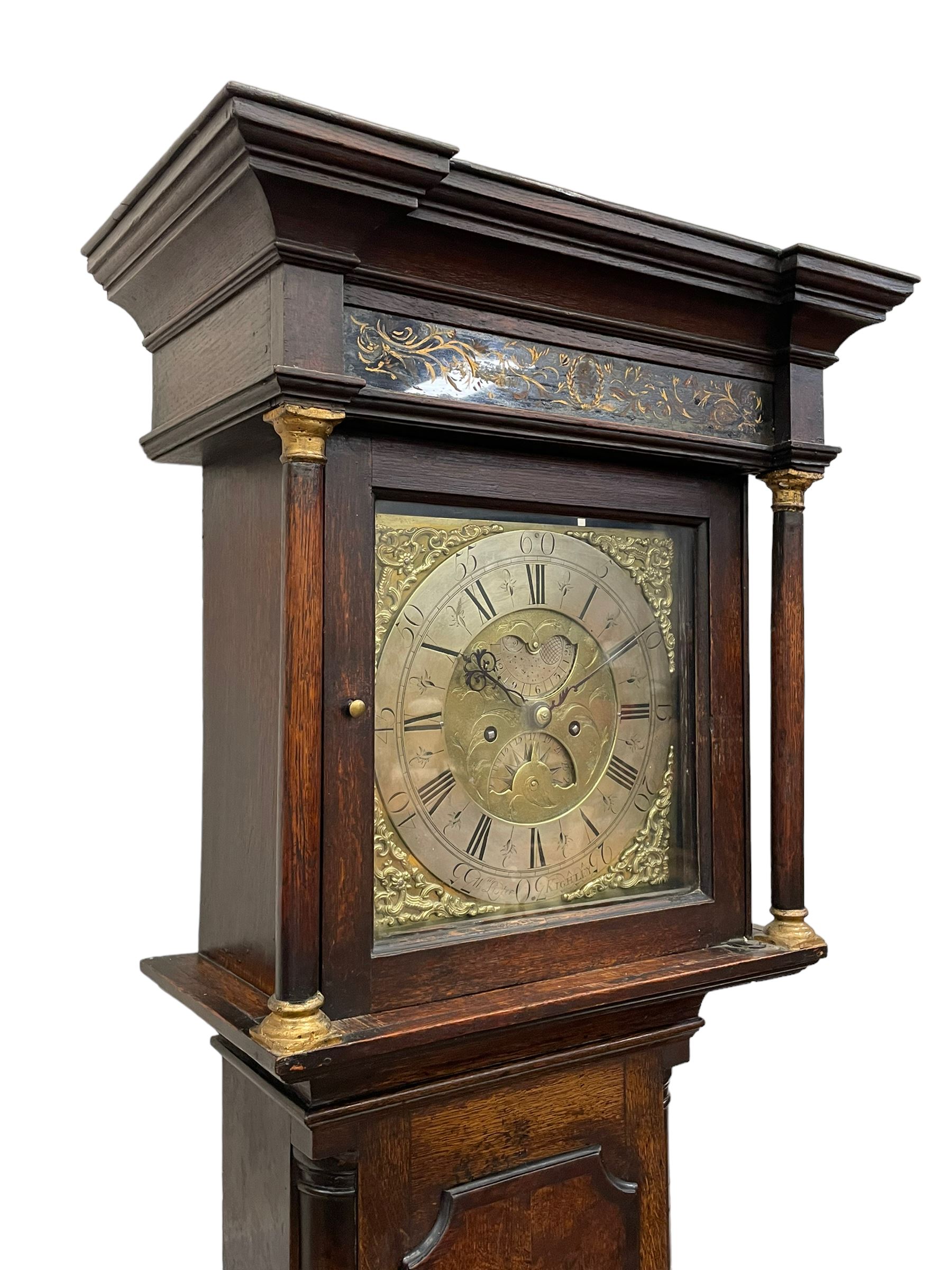 William Lister (II) of Keighley – 8-day 18th century oak cased longcase clock c1760, hood with a break front flat topped pediment and eglomise  frieze beneath, square hood door flanked by matching pilasters with gesso capitals, trunk with quarter columns and long trunk door with a flat top and convex shoulders, square plinth with a decorative skirting, 12” brass dial with rococo spandrels, engraved dial center, silvered chapter with Roman numerals, five minute Arabic’s, half hour markers and minute track, semi-circular apertures with engraved calendar and moon phase/lunar age discs, original blue steel fretted hands, four pillar rack striking movement with a recoil anchor escapement, striking the hours on a bell. With pendulum, weights and key.
The Lister family were a prolific family of clockmakers working in the West Riding of Yorkshire during the 18th century. Working in various locations including Halifax, Keighley and Luddenden.
William Lister (I) is recorded as working in Keighley from 1715-37 and his son William (II) from 1735-1785.
