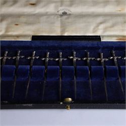 Set of twelve 1920s silver novelty cocktail sticks, modelled as swords, hallmarked Mappin and Webb, Sheffield 1929, contained within tooled leather case