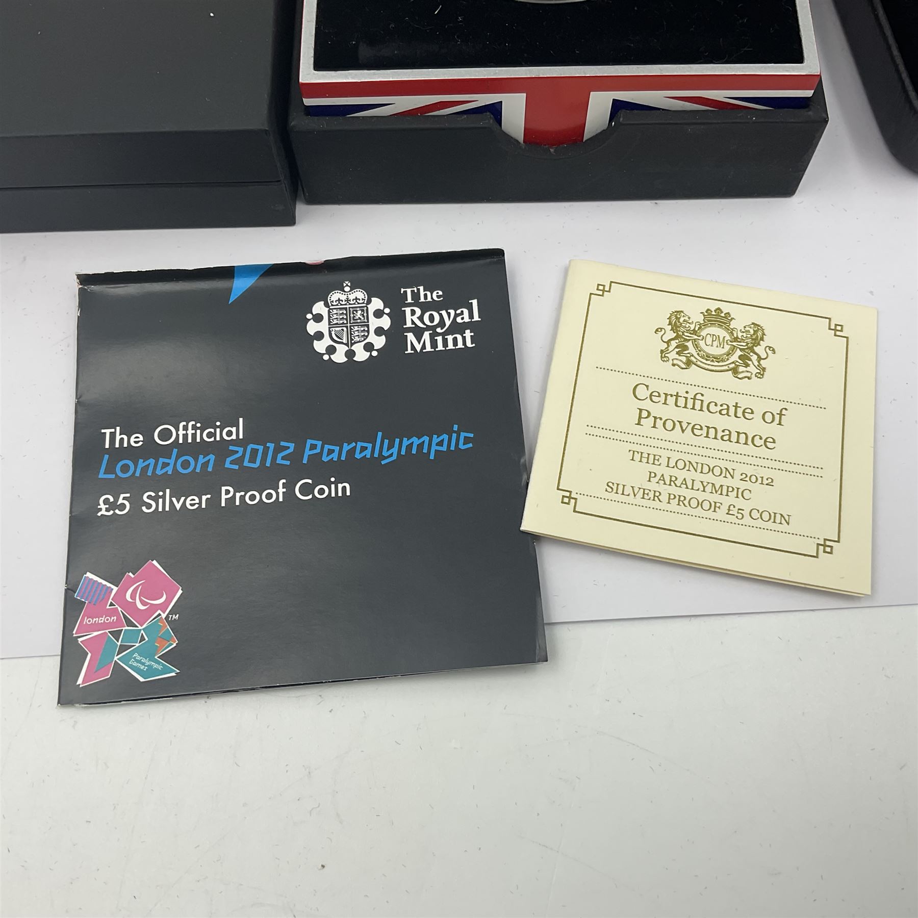 Three The Royal Mint United Kingdom silver proof five pound coins, comprising 2012 'London 2012 Paralympic', 2015 '100th Anniversary of the Death of Edith Cavell' and 2017 'Remembrance Day' piedfort, all cased with certificates 