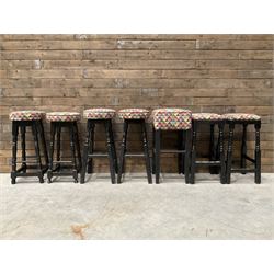 Seven tall bar stools with upholstered seat