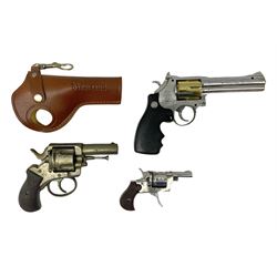 Early 20th century Flobert 5mm blank firing revolver with six-shot chamber, top venting, nickel plated with folding trigger No.118 L12.5cm overall; replica non-firing 'British Bulldog' revolver; and Windproof gas lighter inscribed 'Revolver-99 Spring and Autumn' in holster marked 'Star-Line'