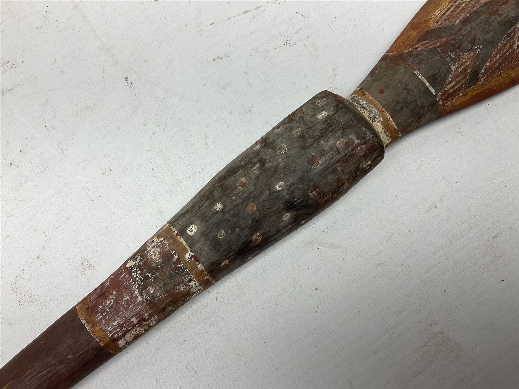 Australian Aboriginal shield, carved with Kangaroo and Emu, 74.5cm; Spear painted with aquatic creatures 78cm, and Spear thrower 81cm (3)