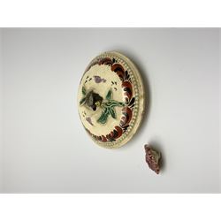 18th century creamware teapot, probably Leeds, with reeded entwined handle and floral finial to the cover, the body with hand painted polychrome decoration of figure to one side, and floral spray to the other, collectors paper label beneath inscribed Leeds Pottery, H11.5cm