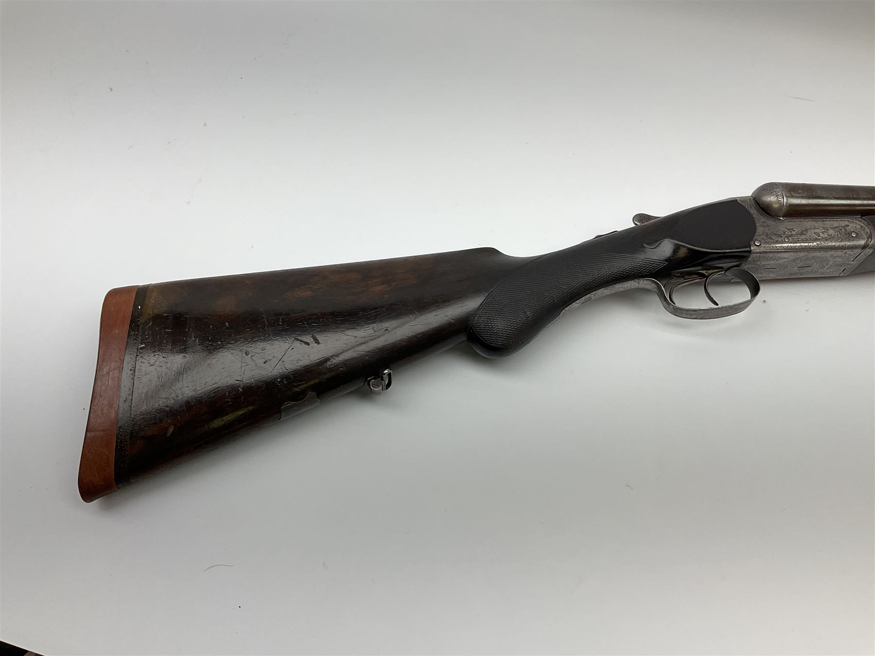 Lincoln Jeffries 12-bore side-by-side double barrel lightweight boxlock non-ejector sporting gun,  out-of-proof 66cm damascus barrels with sunken ribs, profusely engraved action, Prince of Wales walnut stock with chequered pistol grip and fore-end and thumb safety, sling swivels under barrel and stock, serial no.2139(?), L107.5cm overall RFD ONLY