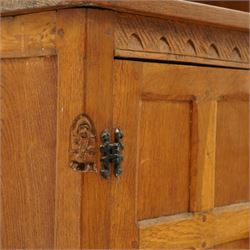 Gnomeman - adzed oak dresser, arcade carved cresting rail over two lead glazed doors, double cupboard below enclosed by two panelled doors, with carved gnome signature, by Thomas Whittaker of Littlebeck 