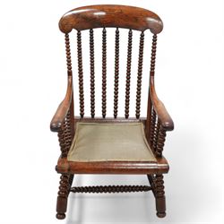 19th century simulated rosewood and stained beech framed armchair, shaped cresting rail over bobbin turned rails, on bobbin tuned supports united by stretchers 