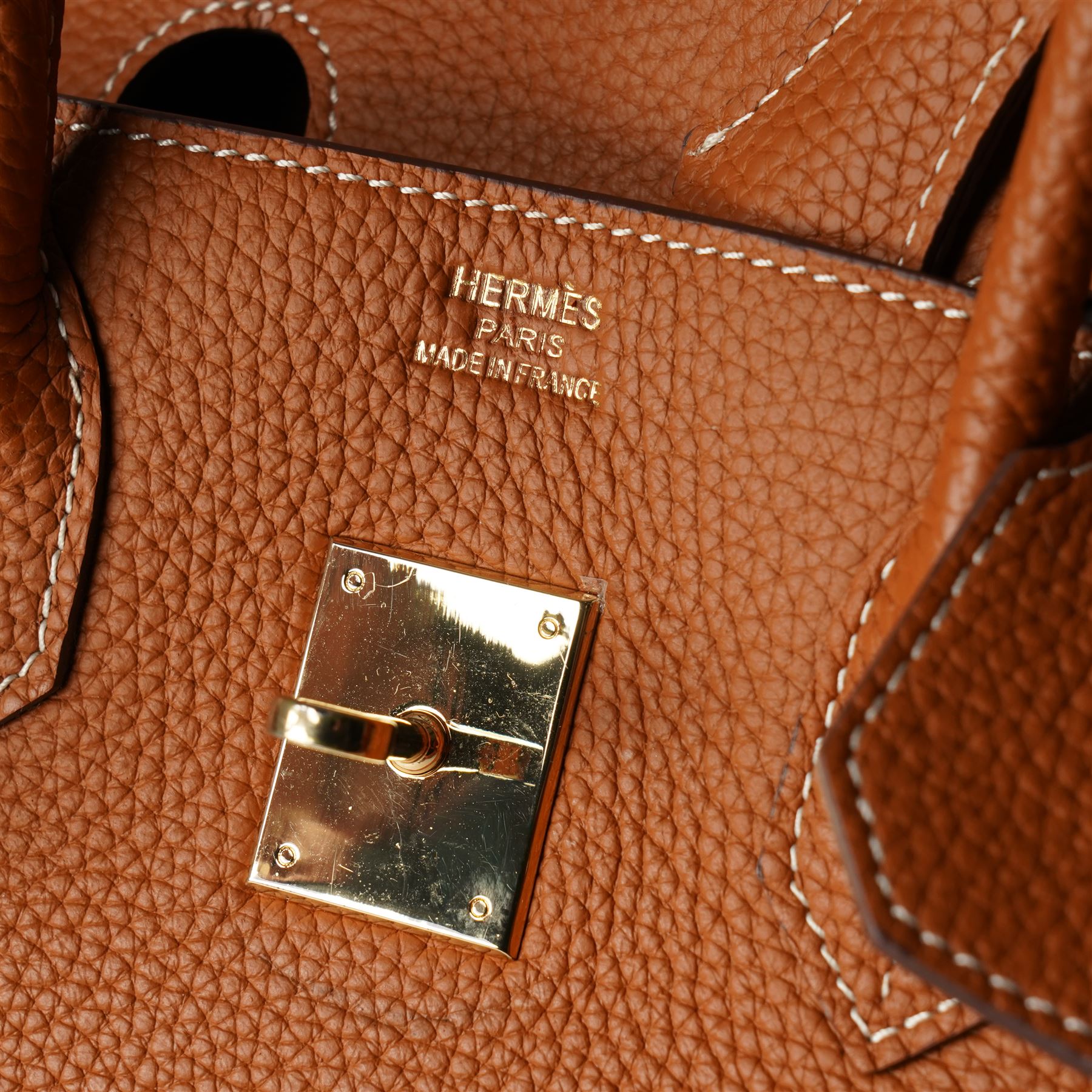 Hermès - gold hardware 'Birkin 35' handbag in gold Togo leather with white stitching, featuring gold-plated hardware, double rolled handles, front flap, belted turn-lock closure, and leather lining with one zip and one slip pocket, stamped 'Hermes Paris Made in France' in gold, with blind-stamp Q (2013) with craftsman’s code 70A to the underside of locking belt. Accompanied by: padlock, keys, clochette, Hermes dust bag, booklet, and ribbon. New unused condition.
