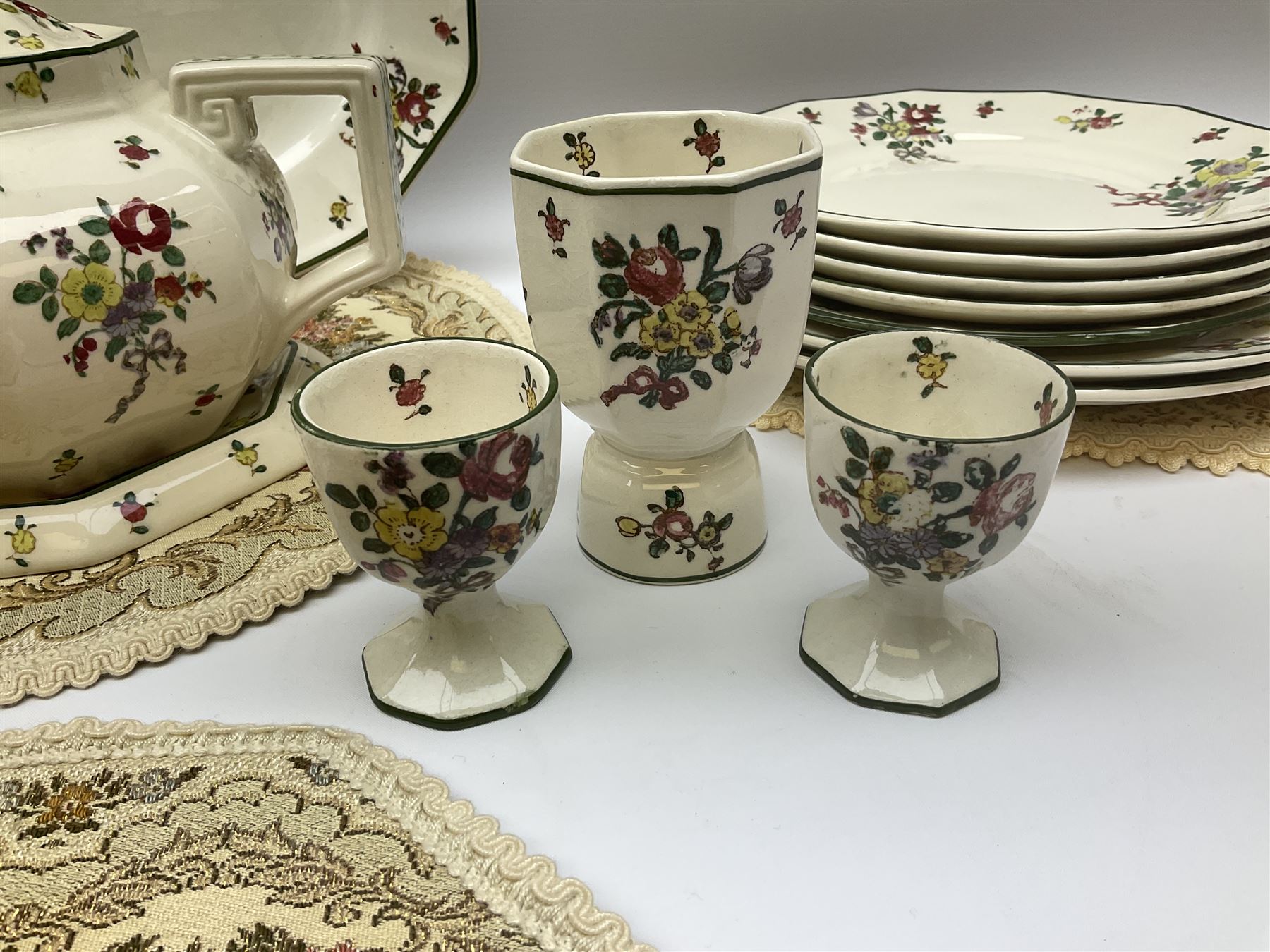 Royal Doulton part dinner service in Old Leeds Sprays pattern,  to include cheese dome, teapot and stand, egg cups etc, together with a selection of floral doilies.  