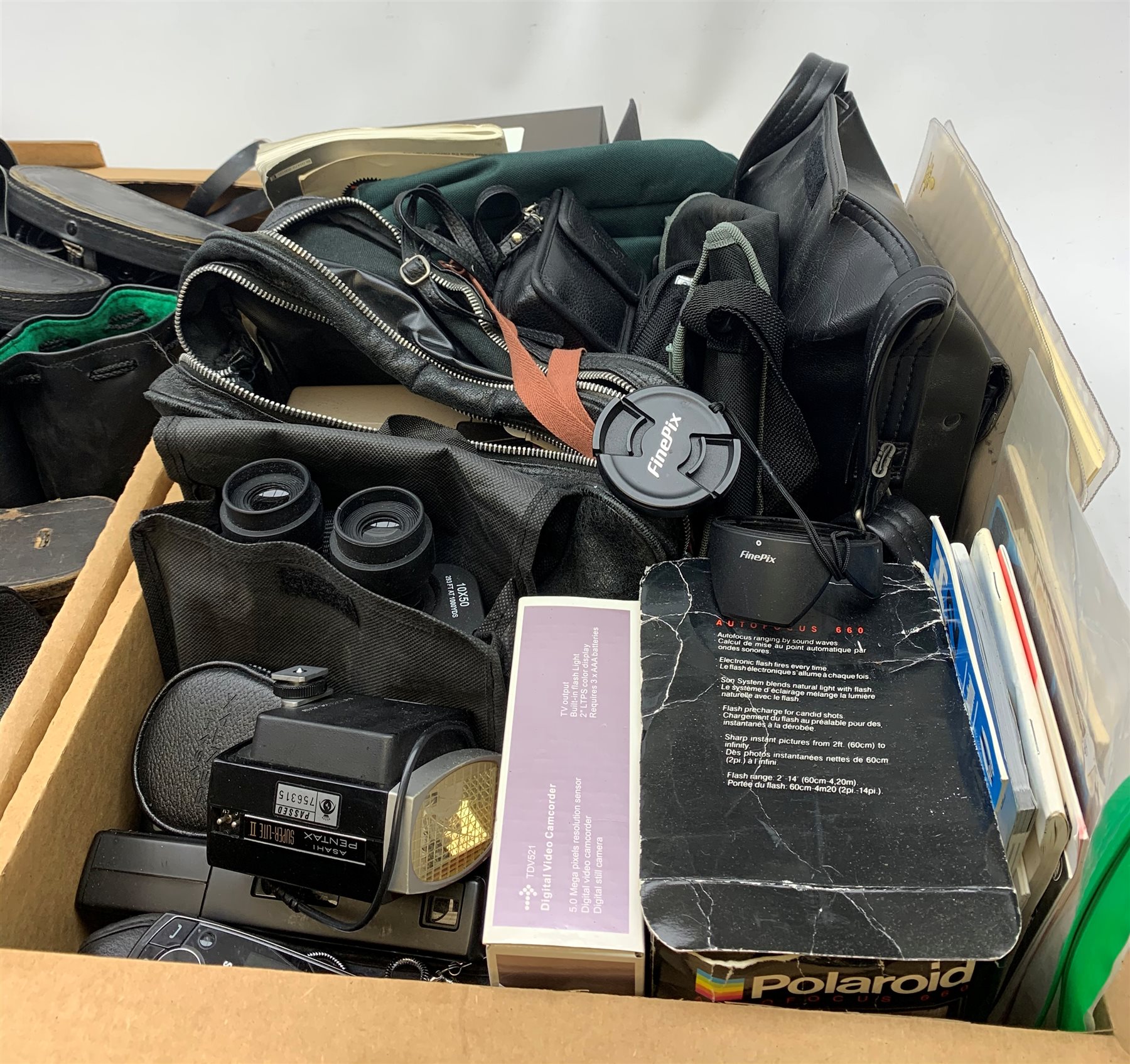 A collection of assorted cameras and accessories, to include examples