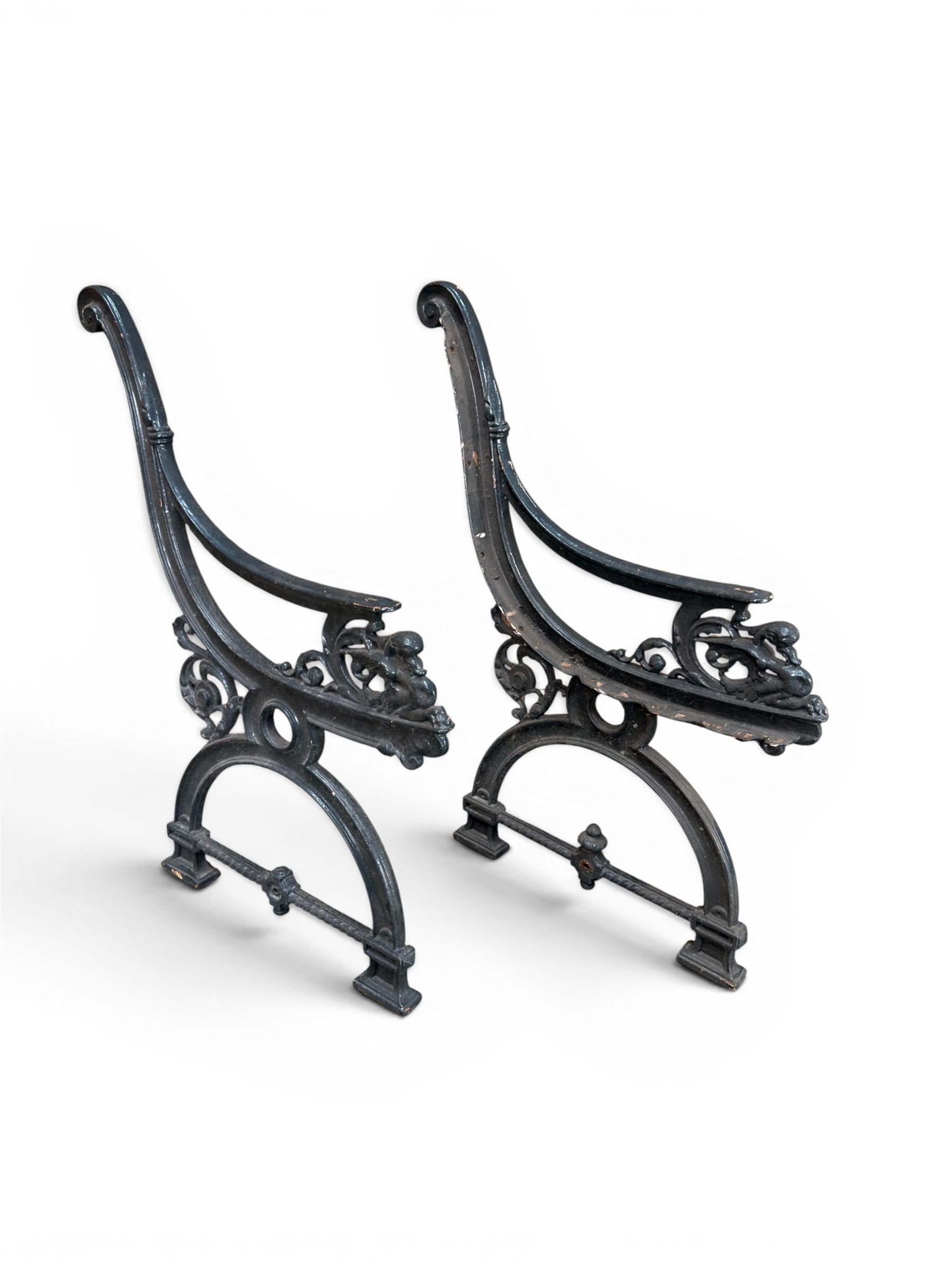 Yates Haywood - pair of 19th century cast iron bench ends, winged griffin detail, arched legs with rope turned decoration, finish in green paint, registration number 206550, first registered 8 March 1867 (see illustration), length as required