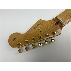 Fender Stratocaster 50th Anniversary 2004 metallic gold electric guitar; serial no.MZ4116369; L98cm; in Spider fitted case with owners manual and other paperwork, strap and belt buckle etc