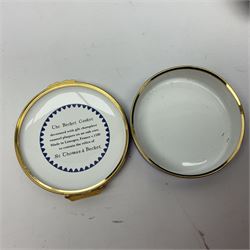 Halcyon Days bonbonniere, modelled as pink roses in a planter painted with a blue and white Japanese scene, together with five Halcyon Days enamel boxes, one a larger example depicting 'The Becket Casket' and four smaller boxes, including The 1993 Easter Egg, Happy Birthday and Statue of Liberty examples, all boxed, Becket Casket D8cm