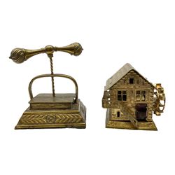 Brass novelty tape measure in the form of a book press, the complete printed tape in cm and inches and wound from the screw, and brass tape measure in the form of a Swiss water mill, the complete printed tape in cm and inches, book press H5cm