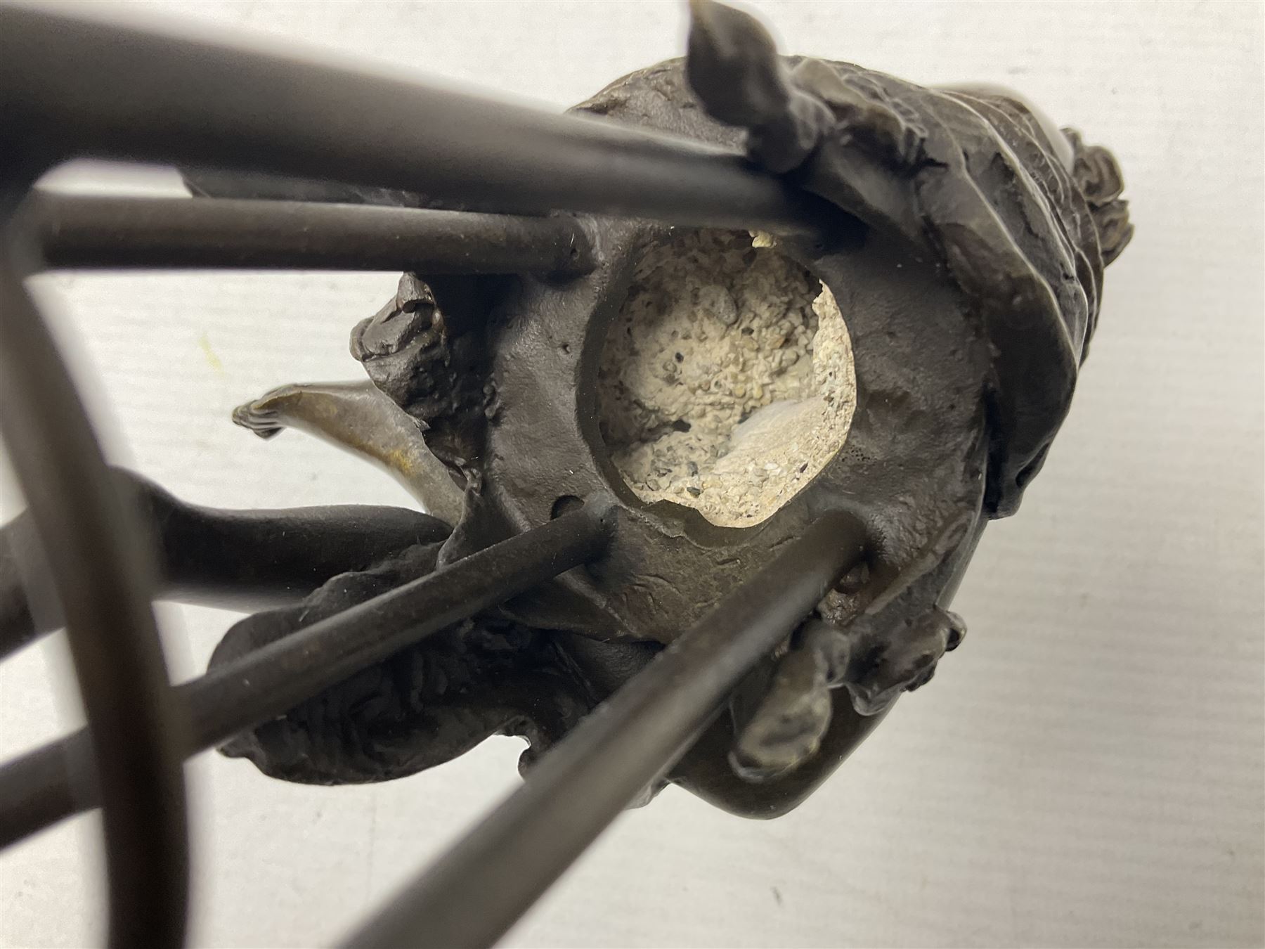 Art Deco style bronze modelled as a female figure seated upon a chair holding an apple, after 'Pierre Collinet', H28cm