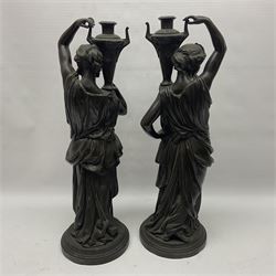 Pair of bronzed female figures, in neoclassical dress, each holding an urn upon her shoulder, H51cm