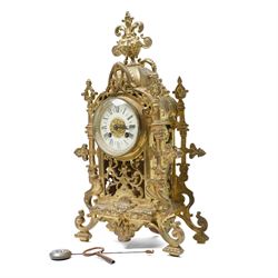 Early 20th century brass mantle clock with white dial and bell strike H42cm