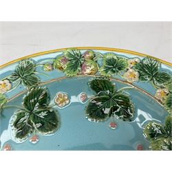 George Jones style Majolica strawberry set, comprising of a dish, serving spoon, sugar bowl and cream jug, decorated with strawberry plants on blue ground, impressed mark beneath, L37cm 