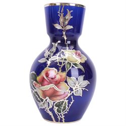 Heinrich vase with silver overlay depicting figures in period dress upon a cobalt blue ground, together with German vase with floral decoration and silver overlay, largest H21cm 