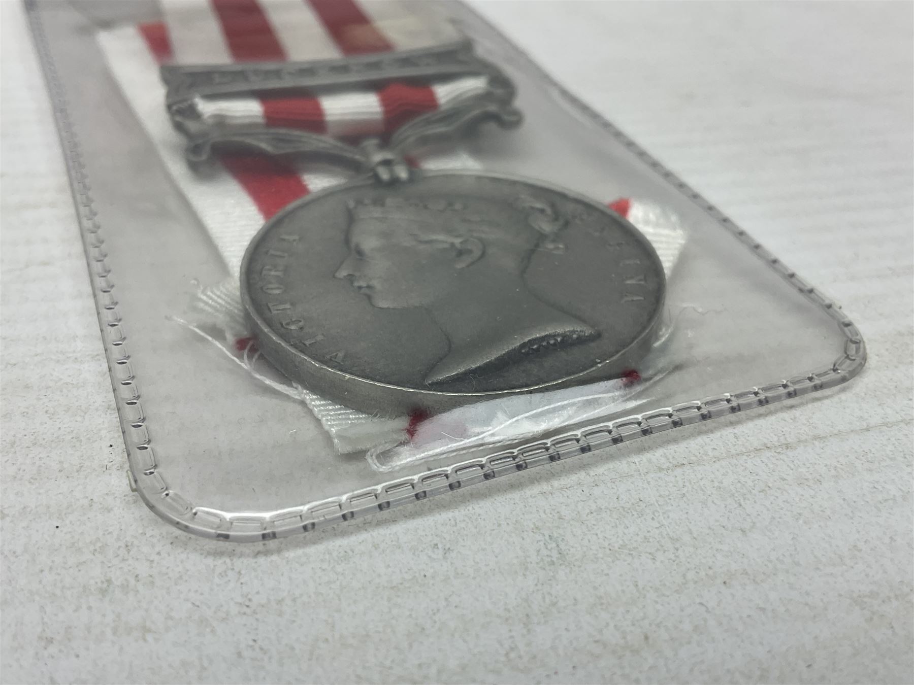 Two Imperial Service Medals to Elsie Hannah Ferguson and Fred Whitehead; each in original case; WWI Special Constabulary Medal to Inspr. Alfred W. Thompson; modern Prisoner of War Medal; cased; replica Victoria Cross and India Mutiny Medals with archive of information relating to Pte. Robert Newell V.C. 9th Lancers; replica Victoria Cross and George Cross with miniatures; and other replica medals etc