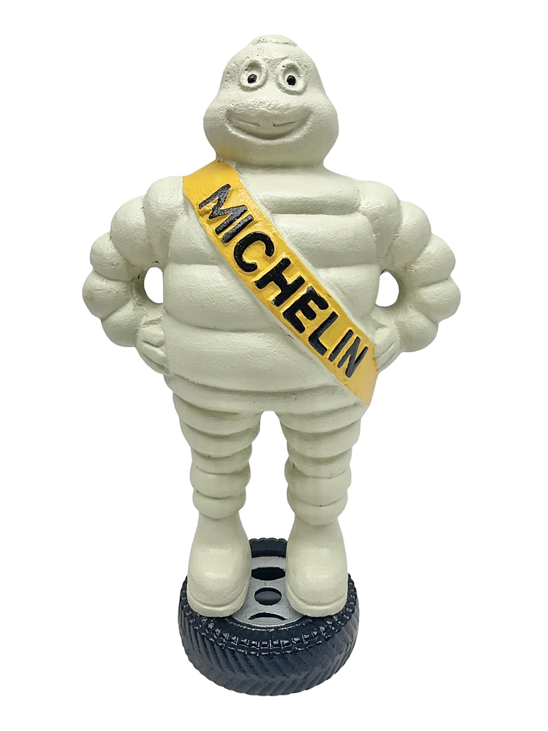 Cast iron figure of Michelin Man, stood on a tyre, H34cm 