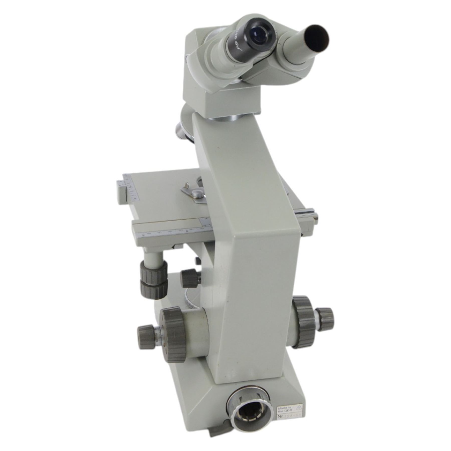 Three microscopes, including Griffin Student Vernier Microscope, Vickers Instruments binocular microscope with Leitz Wetzlar Periplan 10x lenses, and a Carl Zeiss Jena binocular microscope in a wooden Olympus Tokyo box