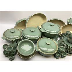 Denby Manor Green pattern dinner ware, including five casserole dishes with lids, butter dish and lid, storage jar with lid, seventeen egg cups,  nineteen soup bowls with twin handles,  three salt pots and two pepper pots, four oval roasting dishes, three pie dishes, three mustard pots with lids, two vinegar pots, eight serving dishes of various shapes and sizes, four bowls, six dinner plates and twelve side plates. 
