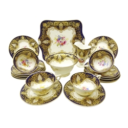  Early 20th century Royal Worcester tea service for six persons hand painted with floral sprays by Ernest Phillips within a royal blue gilded scrolled border, no. c1609, 1919 (21) Provenance Property of Bob Heath, Brandesburton Formerly of Ravenfield Hall Farm near Rotherham  