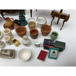 Collection of miniature dolls house furniture and accessories, to include long case clock, chest of drawers, tiled wash stand, ceramics and glass ware, mirror, baskets, etc 