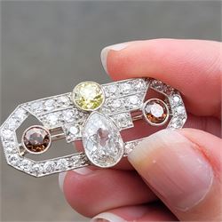 Early 20th century platinum diamond brooch, milgrain set with a pear cut faint brown diamond of approx 1.50 carat, an old cut fancy yellow / green diamond of approx 0.70 carat, and two old cut fancy orange / brown diamonds of approx 0.40 carat and 0.35 carat, surrounded by old cut white diamonds in an openwork setting, total white diamond weight approx 1.45 carat