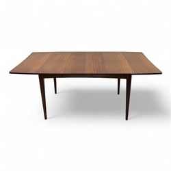 Richard Hornby for Fyne Ladye - mid-20th century afromosia teak dining table, tapered rectangular top with fluted edge and recess for spare leaf, raised on slender legs, teak framed chairs, of ladder back design, with drop-in seat, upholstered seat, with tapered front legs and slightly raked rear legs, retailed by Heals of London, table extended width 181cm depth 86cm height 74cm - chairs width 48cm depth 41cm height 87cm 