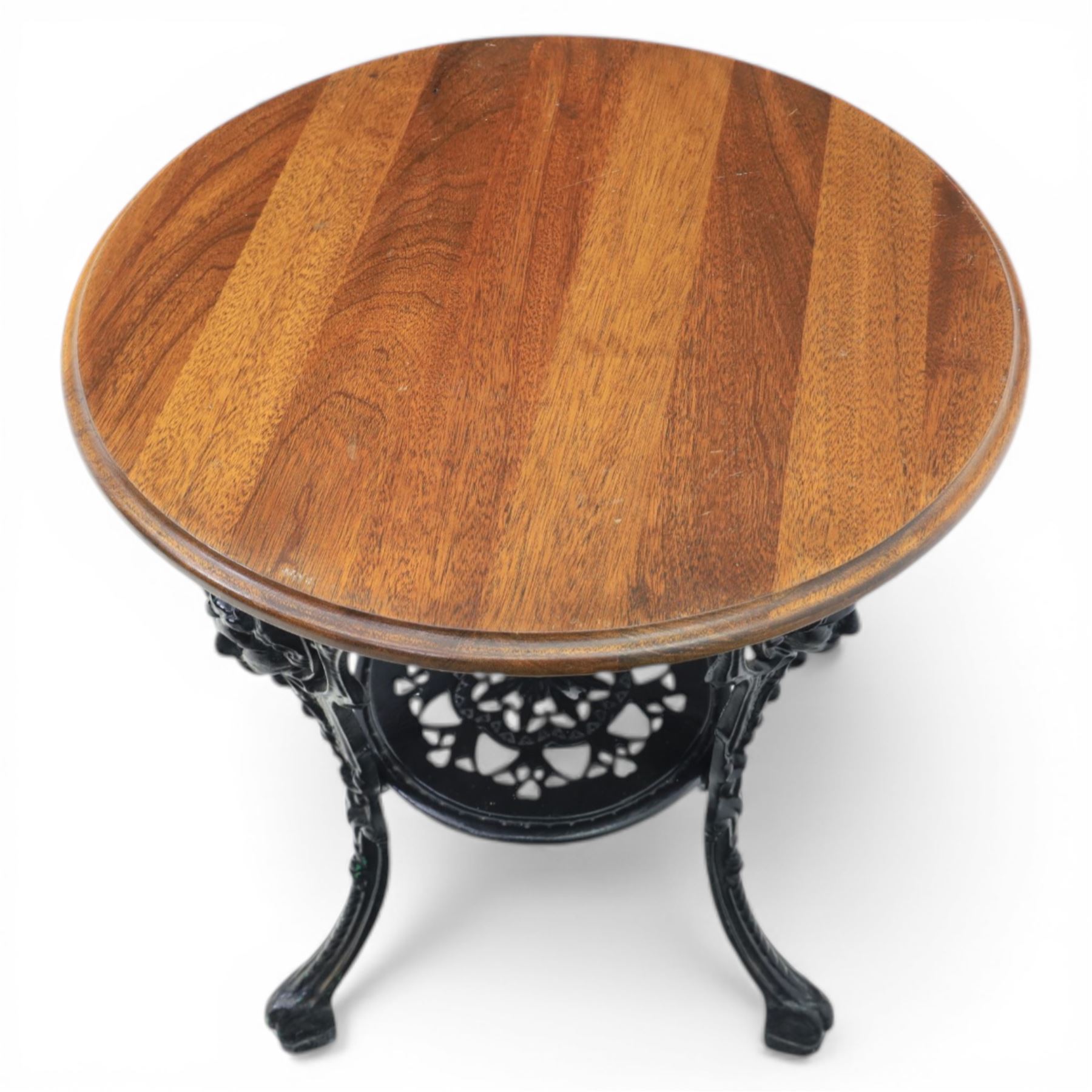 20th century stained hardwood pub table, round boarded top with moulded rim, supported on an ornate pierced cast iron pedestal with scrolling detail and three cabriole supports ending in pad feet