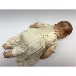 Seyfarth & Reinhardt composition head baby doll with moulded hair, sleeping flirty eyes, open mouth with one tooth and tongue and soft body with composition jointed limbs, marked 'SuR Germany 30/5' H47cm; together with a Golborne Dolls 'Golborne Beauty' composition head and body bride doll, marked 'F.P.23' in original box H63cm (2)