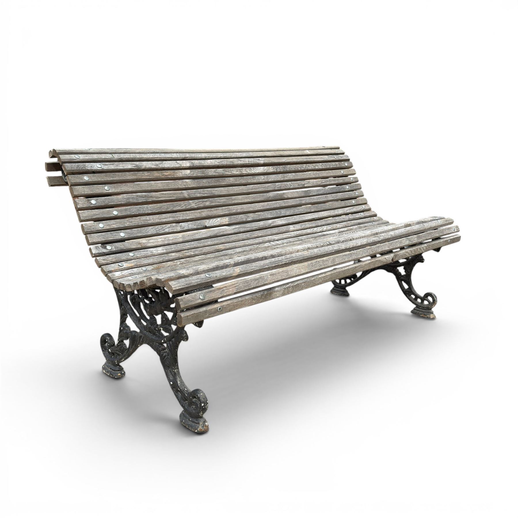 19th century cast iron and wood slatted garden bench, serpentine scroll form, ornate bow ends finished in green paint
