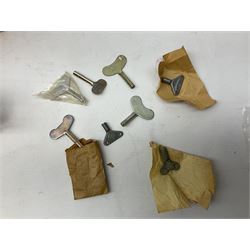 Seven modern Chinese, Japanese and Continental boxed tin-plate toys including Ucan Daire Flying Saucer, Drumming Animal, Circus Clown, Puzzle Cat, Bird with Jumping Action etc; and a quantity of clockwork toy keys (7)