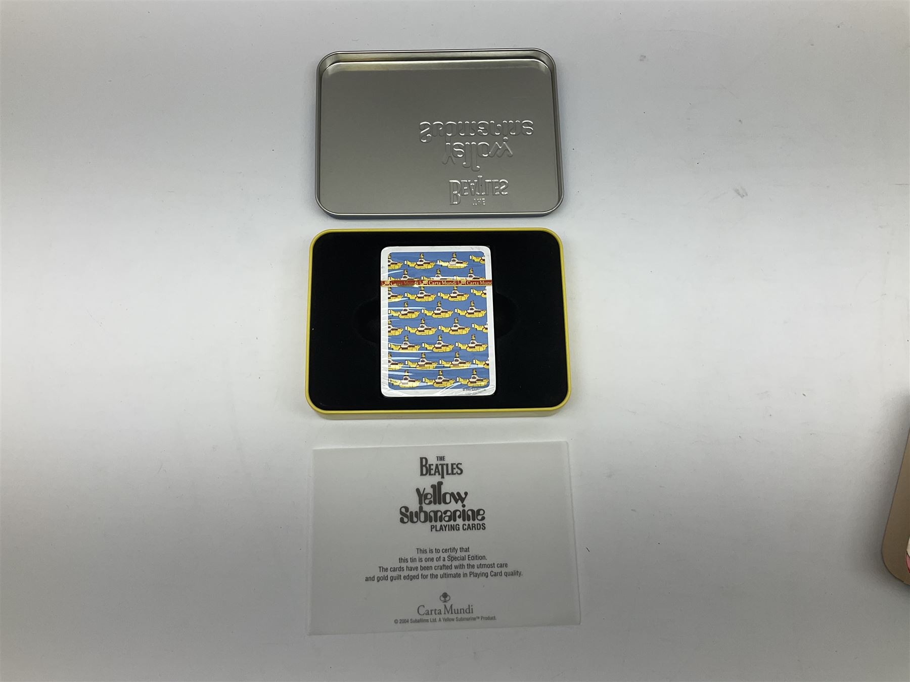 Special edition The Beatles Yellow Submarine playing cards, unopened with gilt edging in a metal tin, together with 1999 McFarlane Toys figures of Yellow Submarine John Lennon and Jeremy Hillary Boob, PH. D, tallest figure 19.5cm 