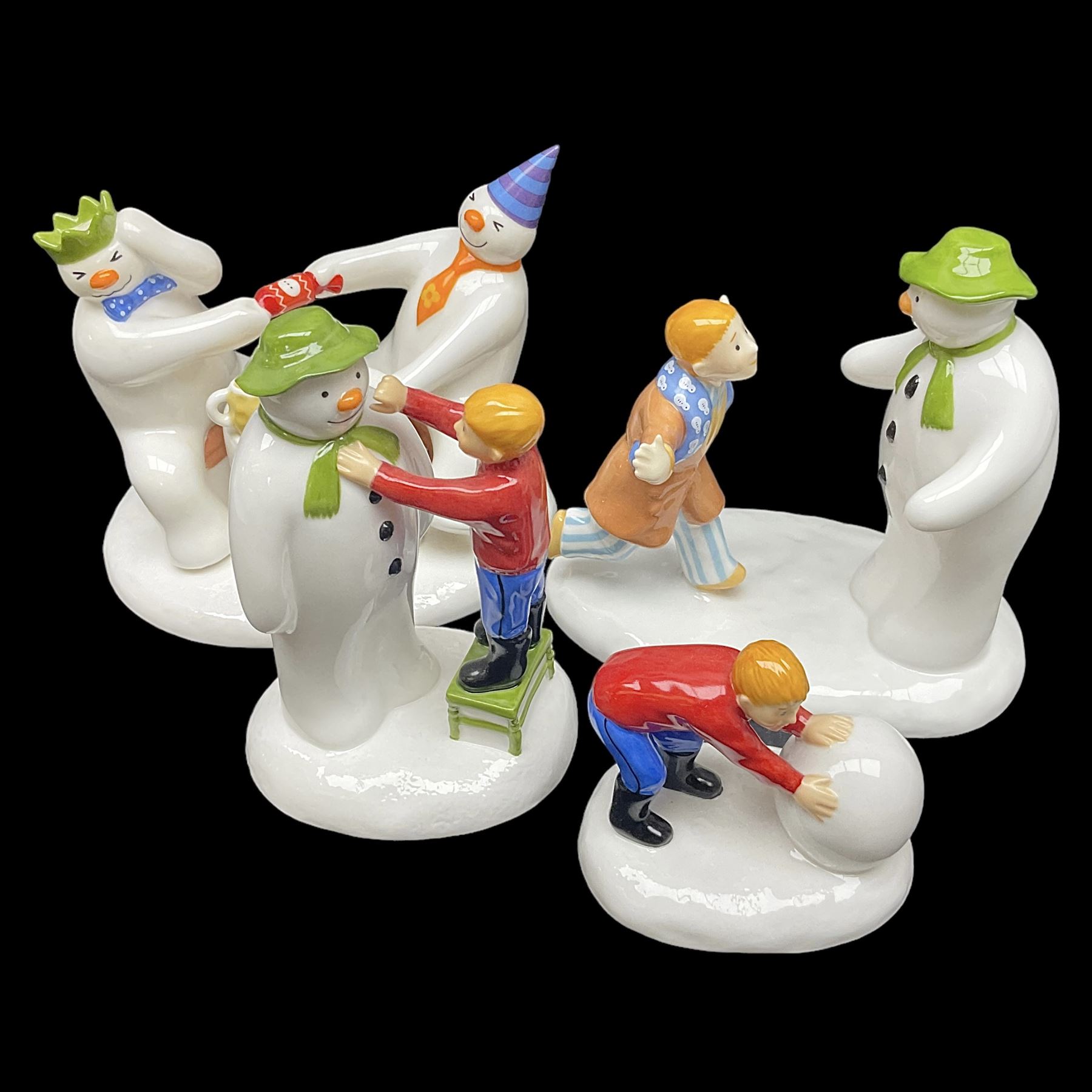 Four Coalport Characters The Snowman figures, comprising I'll Never Forget you with certificate, Pulling a Cracker and Adding a Smile, all with original boxes