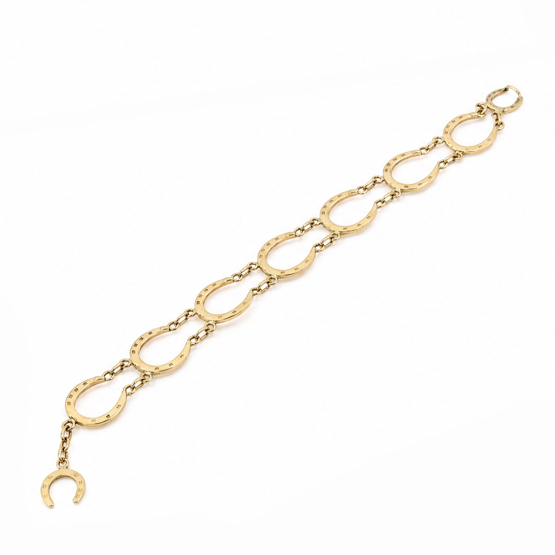 9ct gold horseshoe link bracelet, with toggle clasp, Birmingham 1975