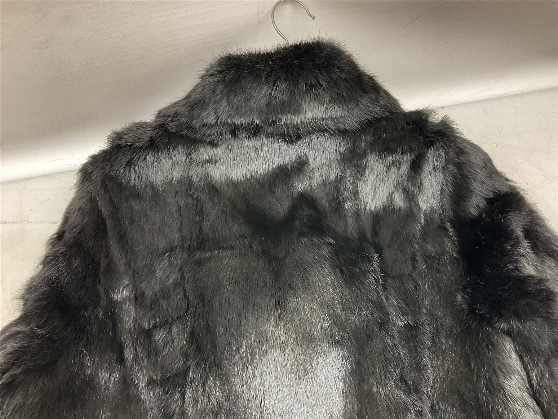 Ladies three quarter length brown mink coat, together with a ladies short black rabbit fur coat 