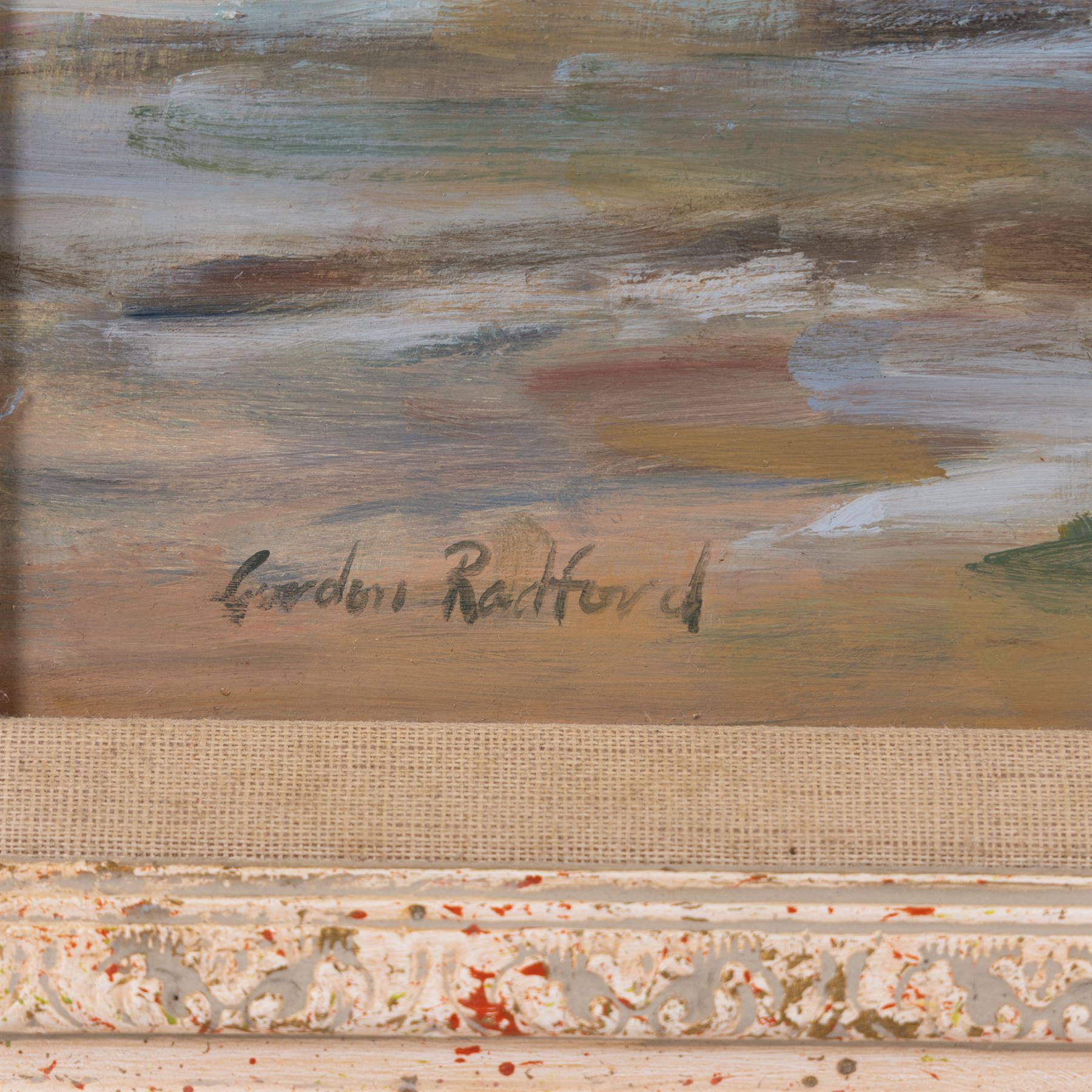 Gordon Radford (British 1936-2015): 'Figures and Beached Vessels on a Sandy Stretch', oil on board signed, titled verso 45cm x 60cm