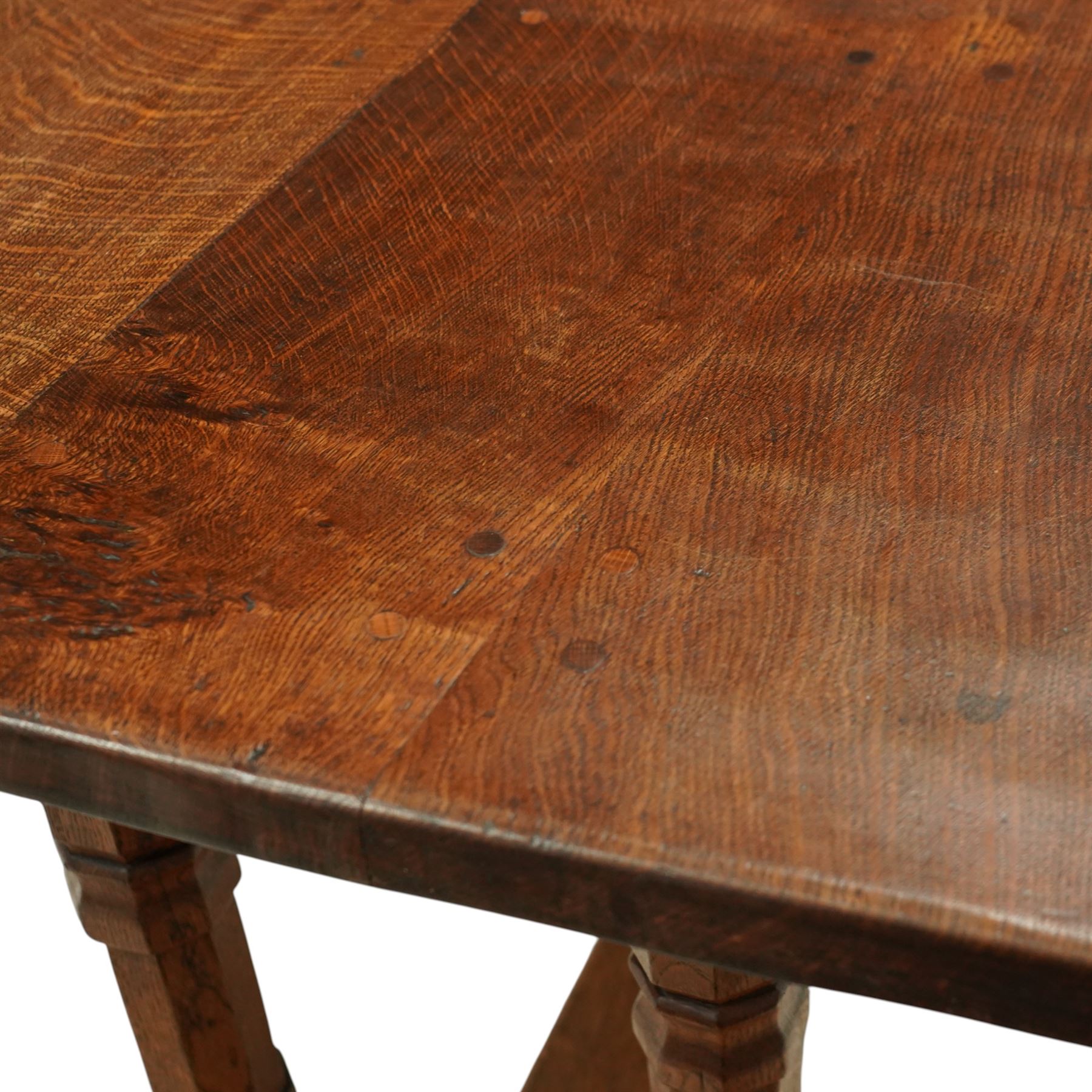 Mouseman - 1937 refectory table, Sir Herbert Baker commission for Westminster Church House, the rectangular adzed plank top above twin octagonal baluster supports united by a pegged stretcher, raised on shaped sled bases carved with a partridge and a loaf of bread, with carved mouse signature to inside leg, by Robert Thompson of Kilburn

The carved loaves reference the original patron, while the partridges are thought to represent Frank Partridge, Bishop of Portsmouth from 1877 to 1941, who played a key role in the founding of Church House and served as its Secretary from 1936 until 1941

Reference
Christie’s ROBERT “MOUSEMAN” THOMPSON; Refectory Table, Lot 188, sold at Christie’s London, commissioned by Sir Herbert Baker KCIE, RA, architect of Church House (opened 1937). Provenance and description available on the Christie’s website
https://www.christies.com/en/lot/lot-4618786