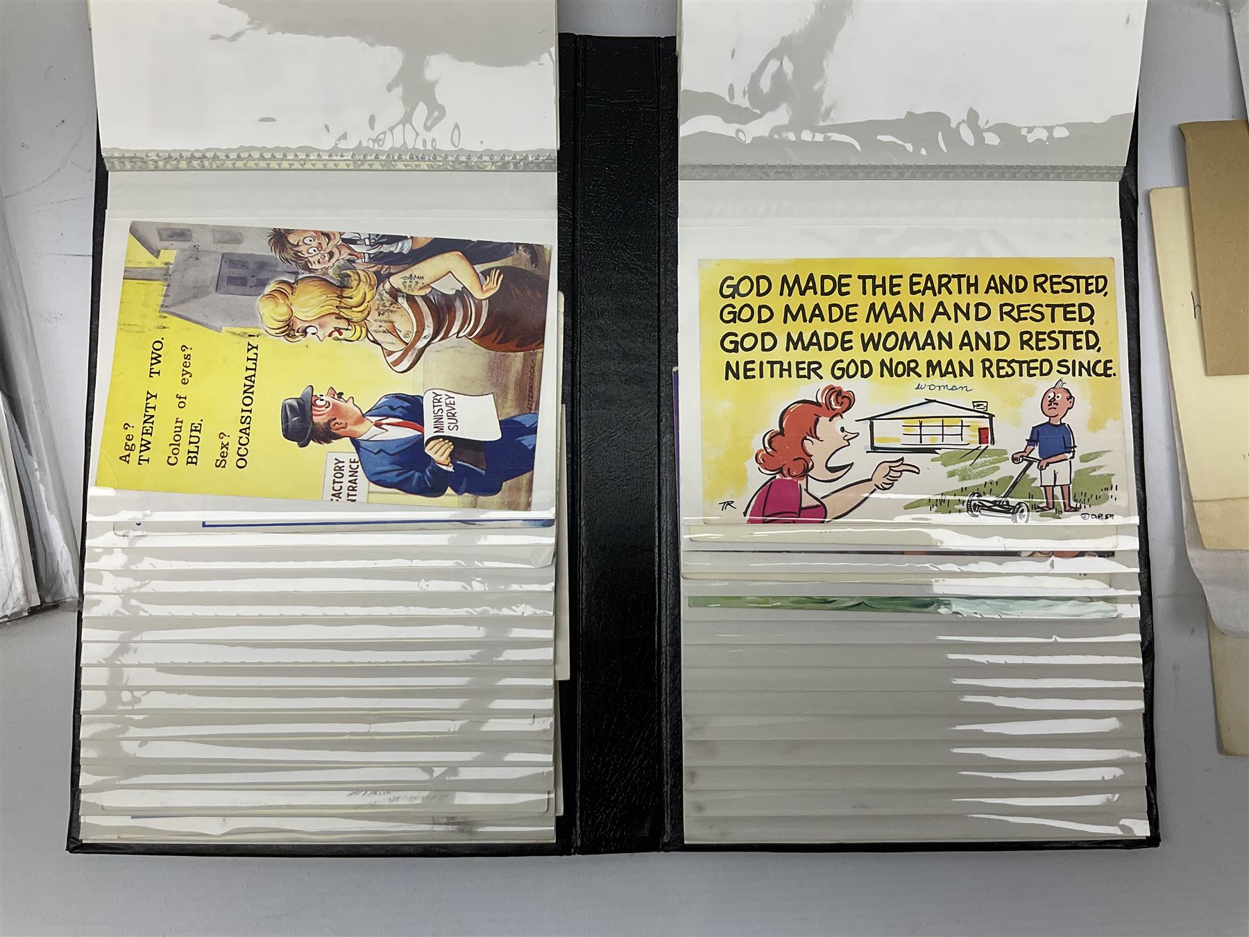 Comic postcards including Bamforth and Quip examples together with WW1 postcards, a collection of world stamps including examples from China, and other ephemera 